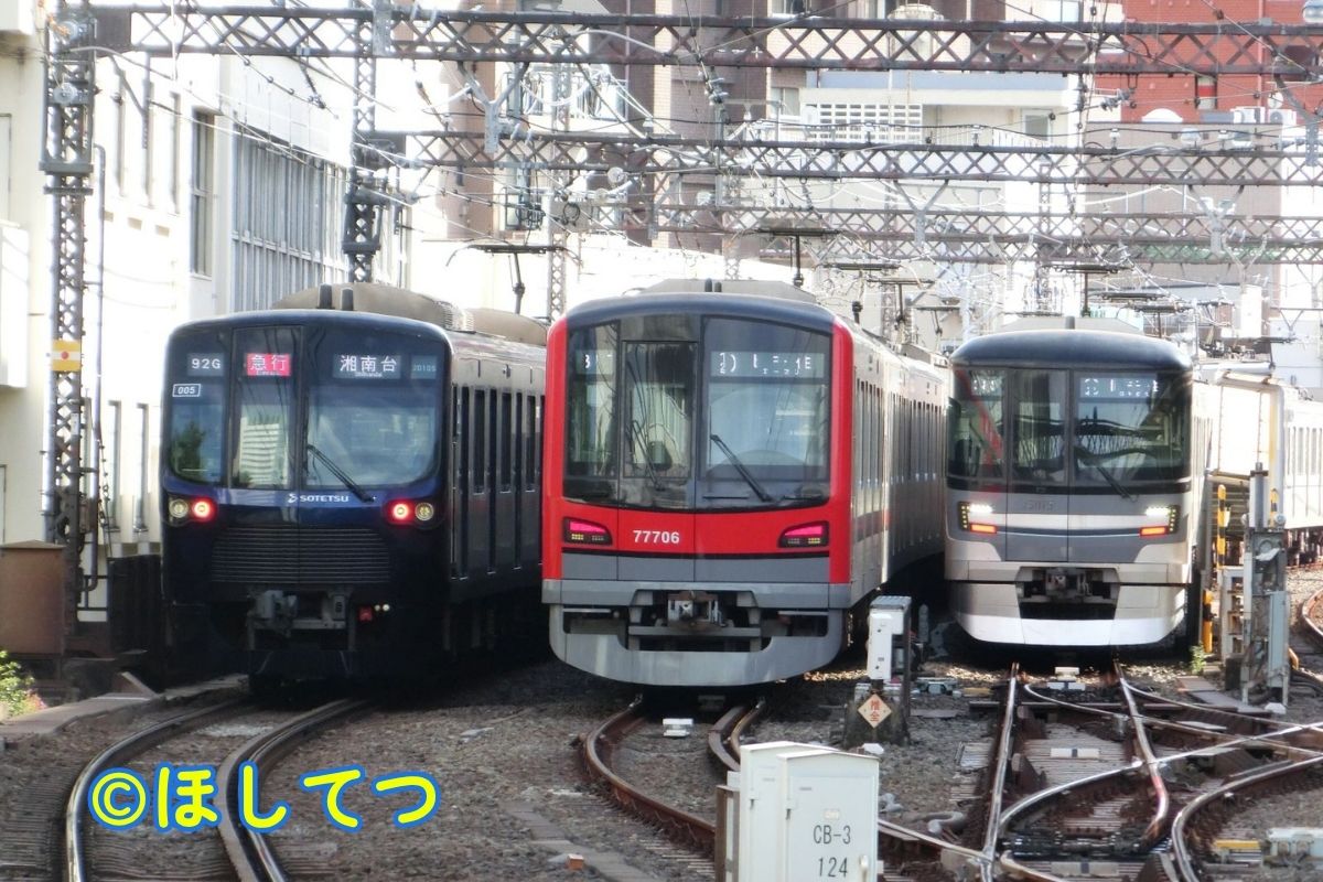 Sotetsu 20000 Series and Hibiya Line trains side by side at Nakameguro Station on Tokyu Toyoko Line